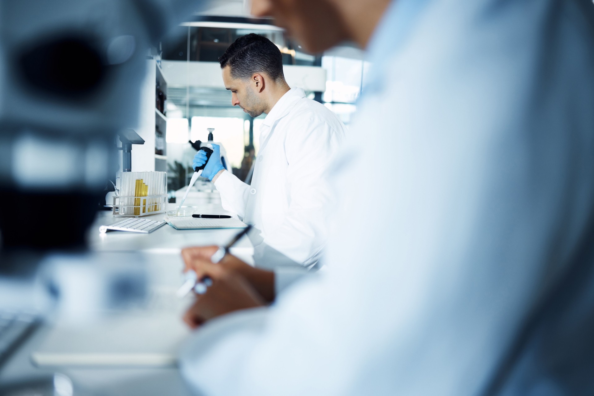 Shot of a young scientist conducting medical research in a laboratory